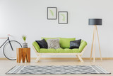 Green sofa and black accent
