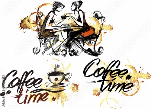two girlfriends drink coffee at the table