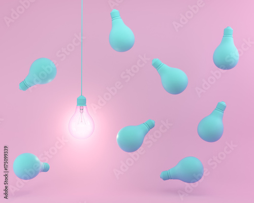 Hanging blue light bulbs with glowing one different idea on pastel pink background. minimal concept. top view.