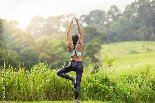 Foto Asian woman doing yoga. Healthy, lifestyle concept.