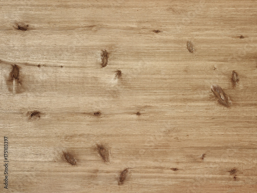 Rustic warm light brown wood board background with knots and grain