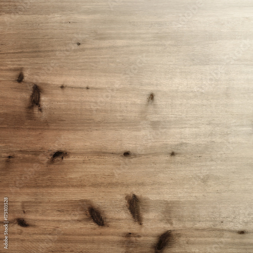 Rustic warm light brown wood board background with knots and grain gradation