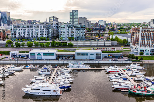 Φωτογραφία Aerial view of old port area with many boats and downtown in city in Quebec regi