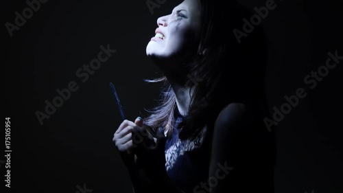 Portrait of a horror Halloween Scream inspired teen girl with a knife