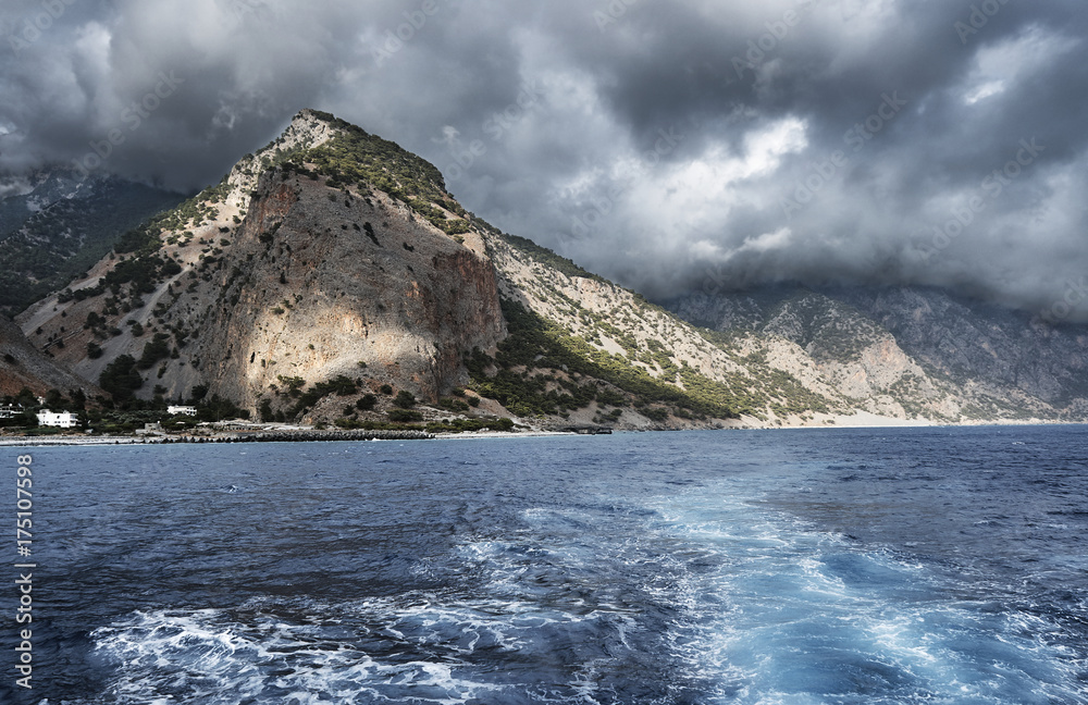 The slope of the mountains on the sea coast of the island of Crete .