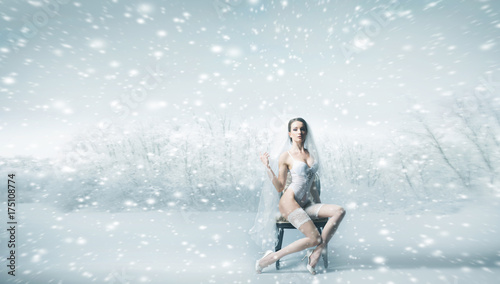 Young sexy bride in erotic lingerie in winter forest with copy space. Fashion, vogue, glamour, concept.