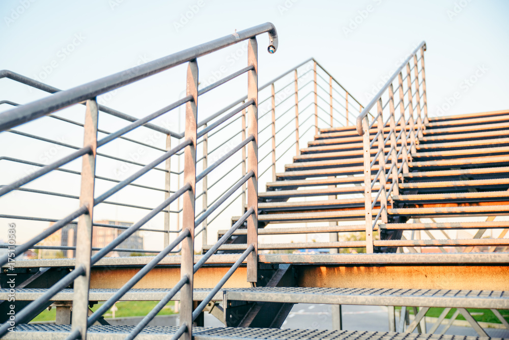 man sitting on stairs and looking on sunset man sitting on stairs and looking on sunset