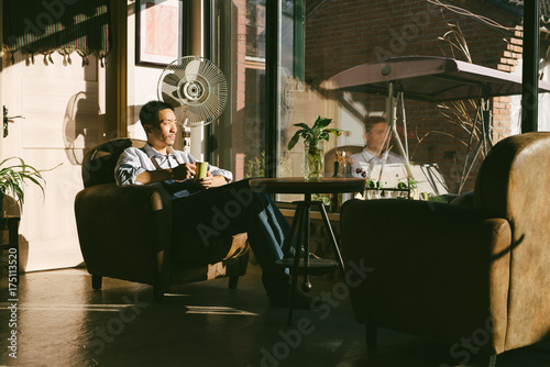 Portrait of young coffee maker photo