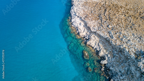 Aerial View: Drone video of iconic beach of Agathi and castle of Feraklos, Rodos island, Aegean, Greece photo