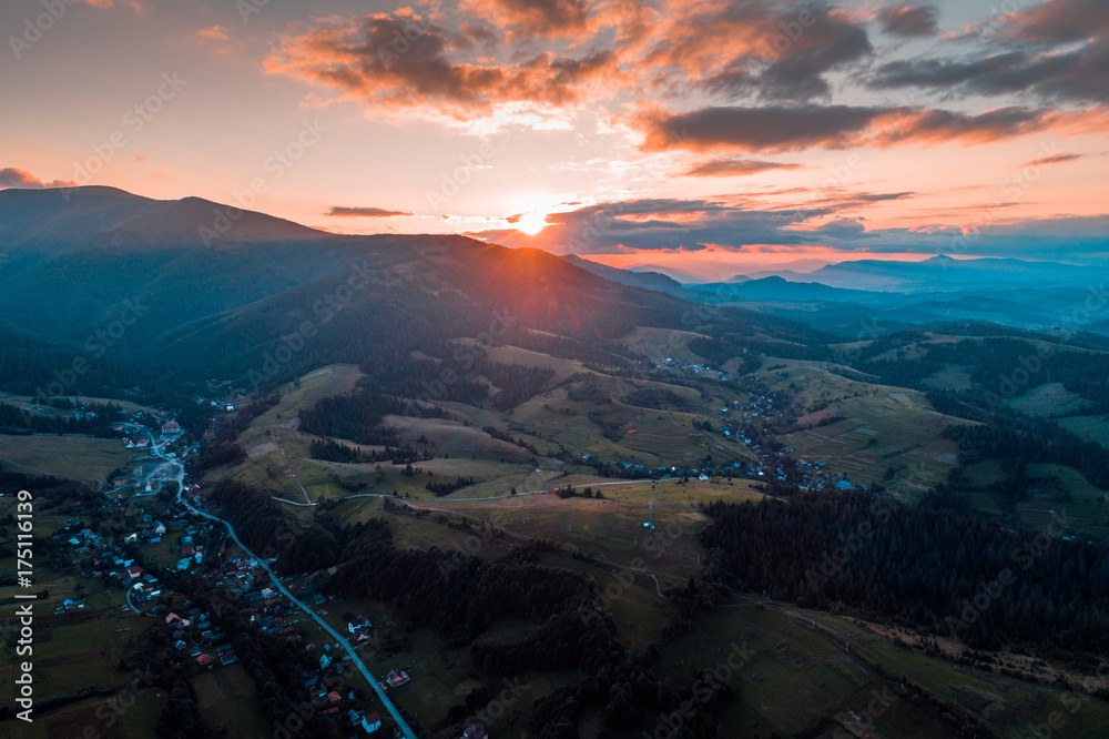 Aerial view of the village in the Carpathian mountains on the Sunset Aerial view of the village in the Carpathian mountains on the Sunset
