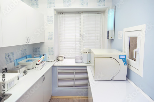Modern sterilization room interrior, handling of dental instruments workplace. © SergeyCash
