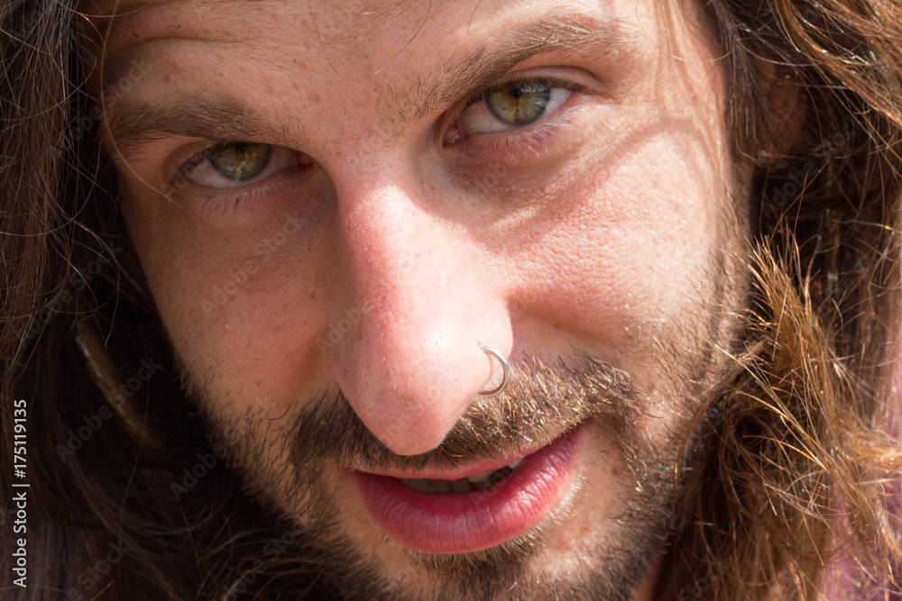 Young man with long hair and beard Young man with long hair and beard