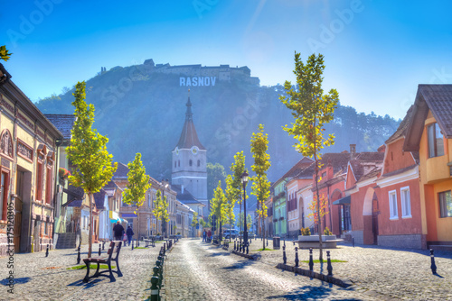 Fotografering Beautiful autumn scene in Rasnov citadel with medieval architecture in downtown