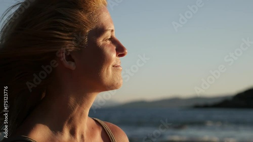  Blonde fremale hair waving on the beach footage - Relaxing of woman on Mediterranean sea photo