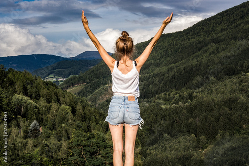 free woman raising her hands photo