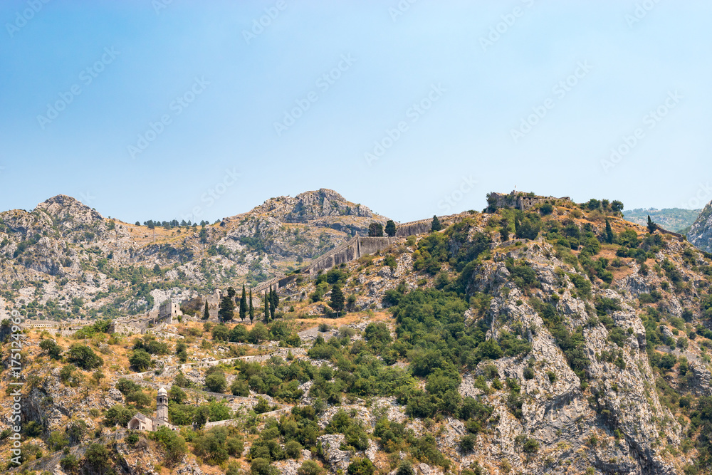 Landscape with Kotor fortress walls and stone staircase steps, Montenegro