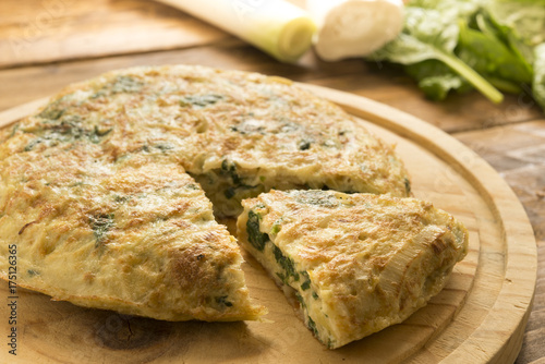 Omelette  of spinach and cheese anf leek photo