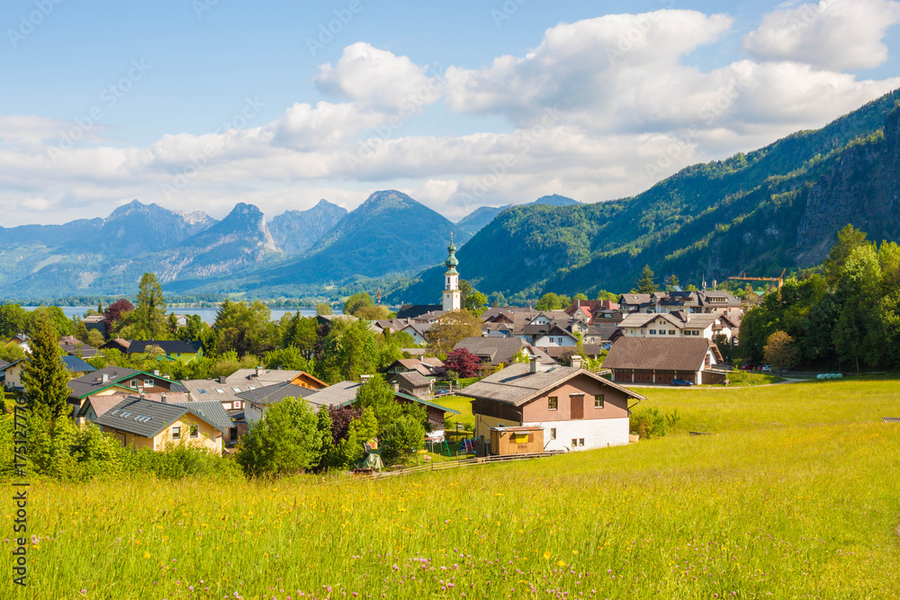 Beautiful view of green alpine meadow and mountain village St. Gilgen, Salzkammergut,  Austria.