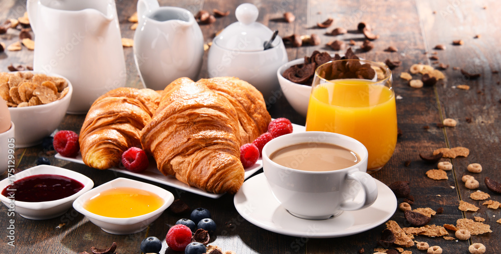 Breakfast served with coffee, juice, croissants and fruits Breakfast served with coffee, juice, croissants and fruits