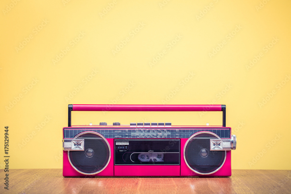Retro outdated red portable stereo radio cassette recorder from 80s front  yellow background. Vintage old instagram style filtered photo foto de Stock  | Adobe Stock