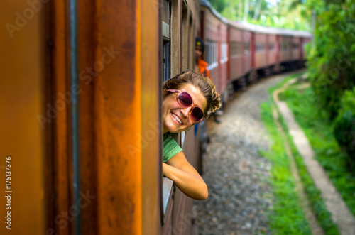 Young woman traveling by train photo