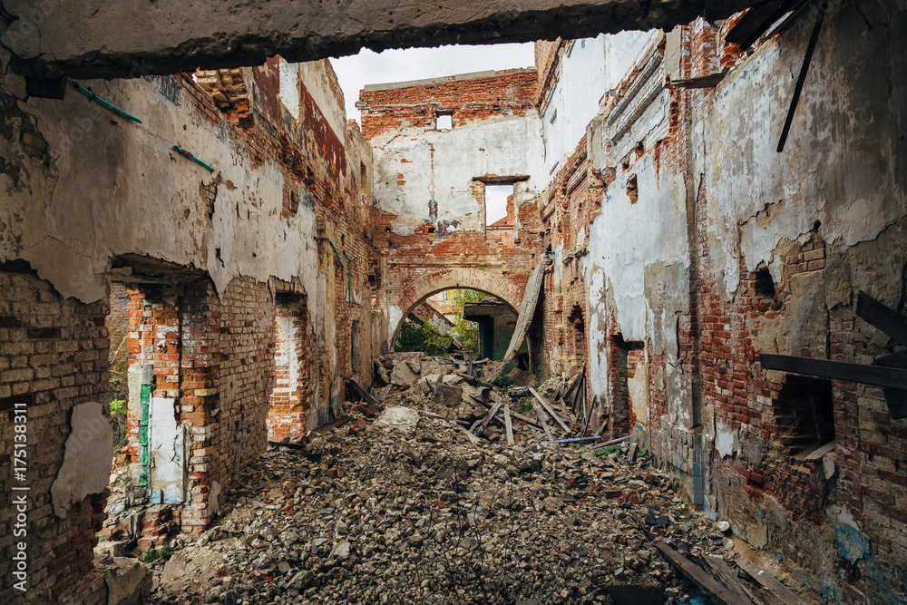 Ruined red brick industrial building. Abandoned and destroyed sugar factory in Novopokrovka, Tambov region Ruined red brick industrial building. Abandoned and destroyed sugar factory in Novopokrovka, Tambov region