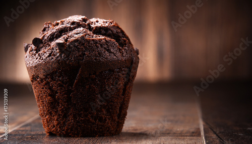 Fotografie, Obraz Chocolate muffin on wooden table