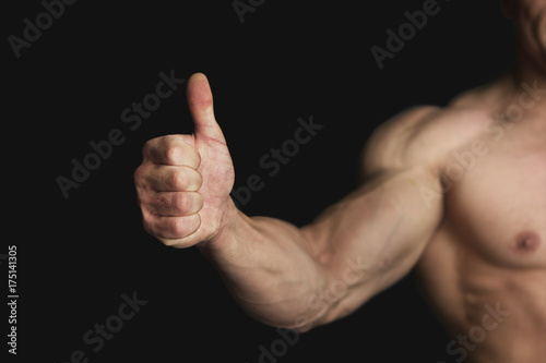 Strong Athletic Man Showing Big Thumb