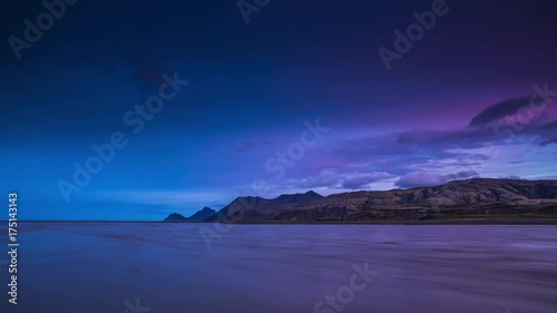 Picturesque landscape of a mountain river with traditional nature of Iceland at amazing sun set. 4K Time Lapse Footage.