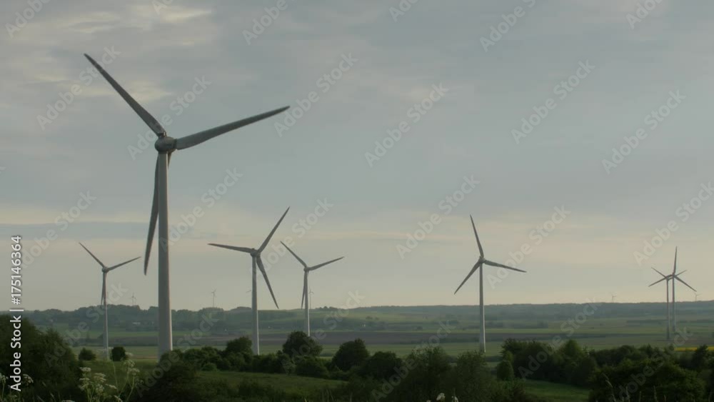 few wind turbines isolated on overcast sky background few wind turbines isolated on overcast sky background