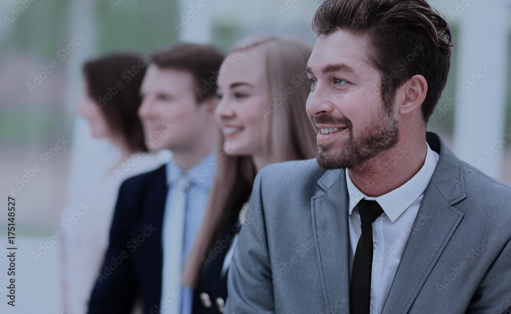 group of business people smiling in an office group of business people smiling in an office