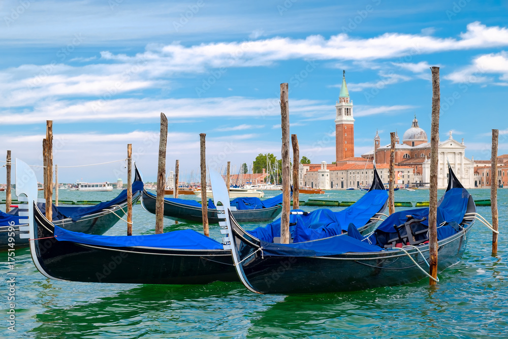 Traditional gondolas docked at St Mark's Square in Venice