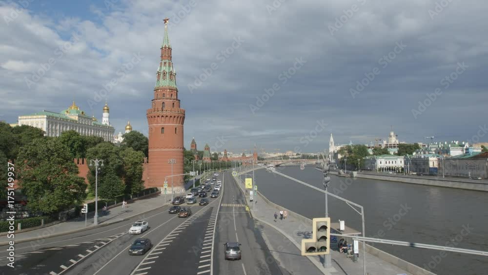 The Kremlin and car traffic on the kremlin embankment - Moscow, Russia The Kremlin and car traffic on the kremlin embankment - Moscow, Russia