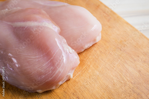 The Raw chicken breast with dill ready to cooking