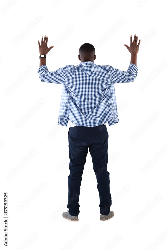 Man pretending to touch an invisible screen against white Man pretending to touch an invisible screen against white