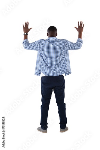 Man pretending to touch an invisible screen against white