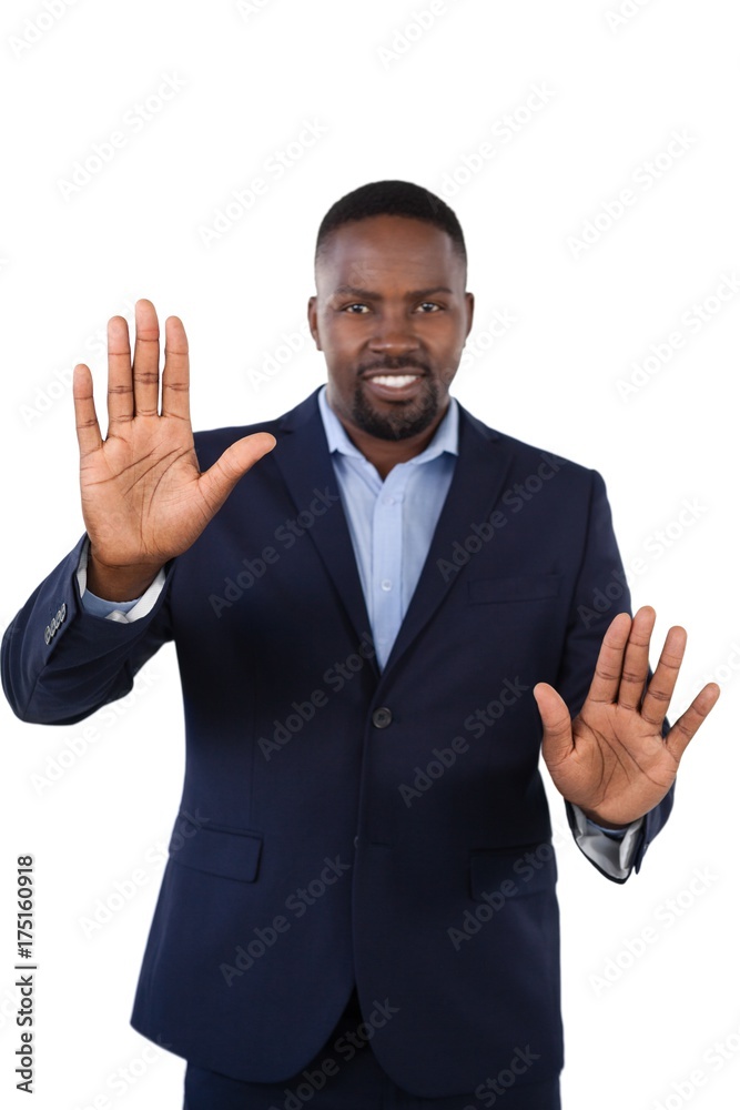 Smiling businessman touching the invisible screen Smiling businessman touching the invisible screen