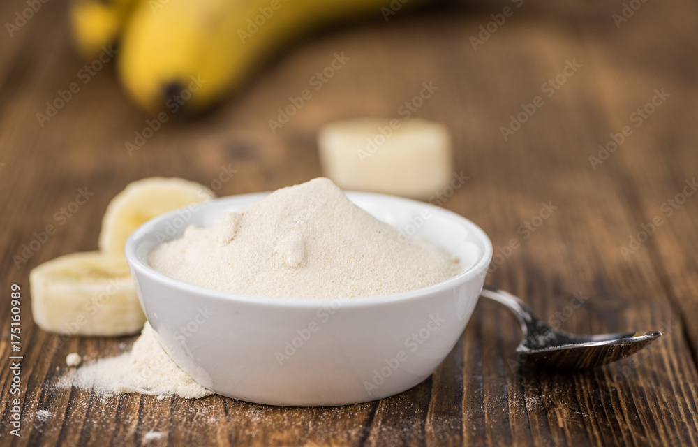 Ground Banana on wooden background; selective focus