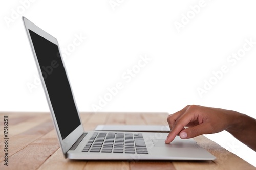 Businesswoman using laptop on the table