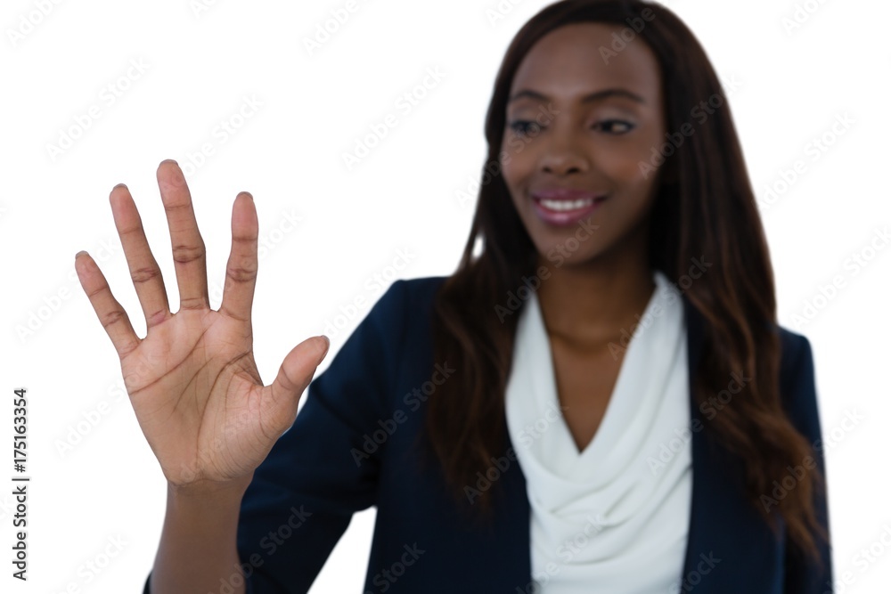 Smiling businesswoman using interface screen against white Smiling businesswoman using interface screen against white