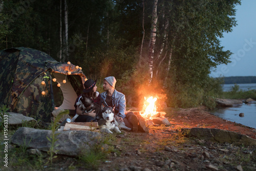 Photography Couple looking at each other with dogs tent nature