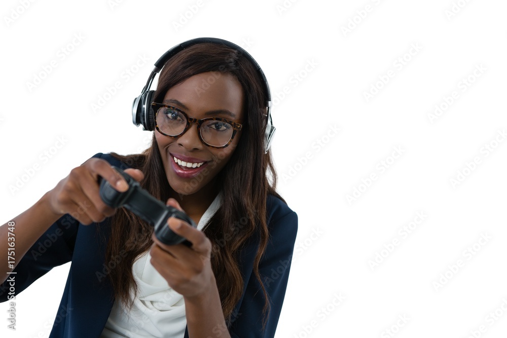 Woman wearing eyeglasses and headphones while playing video game Woman wearing eyeglasses and headphones while playing video game