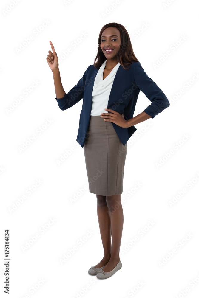 Portrait of smiling businesswoman with hand on hip giving Portrait of smiling businesswoman with hand on hip giving
