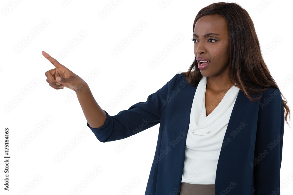 Businesswoman pointing while giving presentation Businesswoman pointing while giving presentation