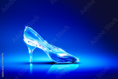 3D image of Cinderella's glass slipper on a blue background photo