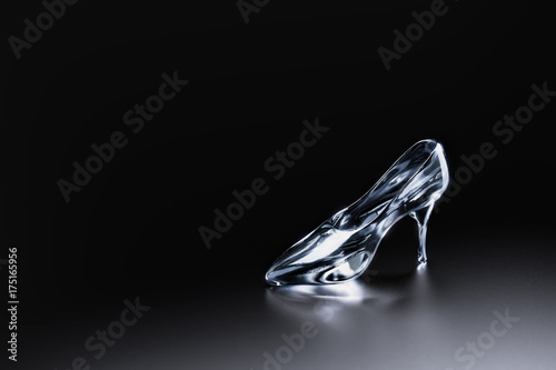 3D image of Cinderella's glass slipper on a blue background © fergregory