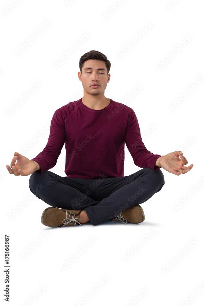 Full length of businessman meditating Full length of businessman meditating