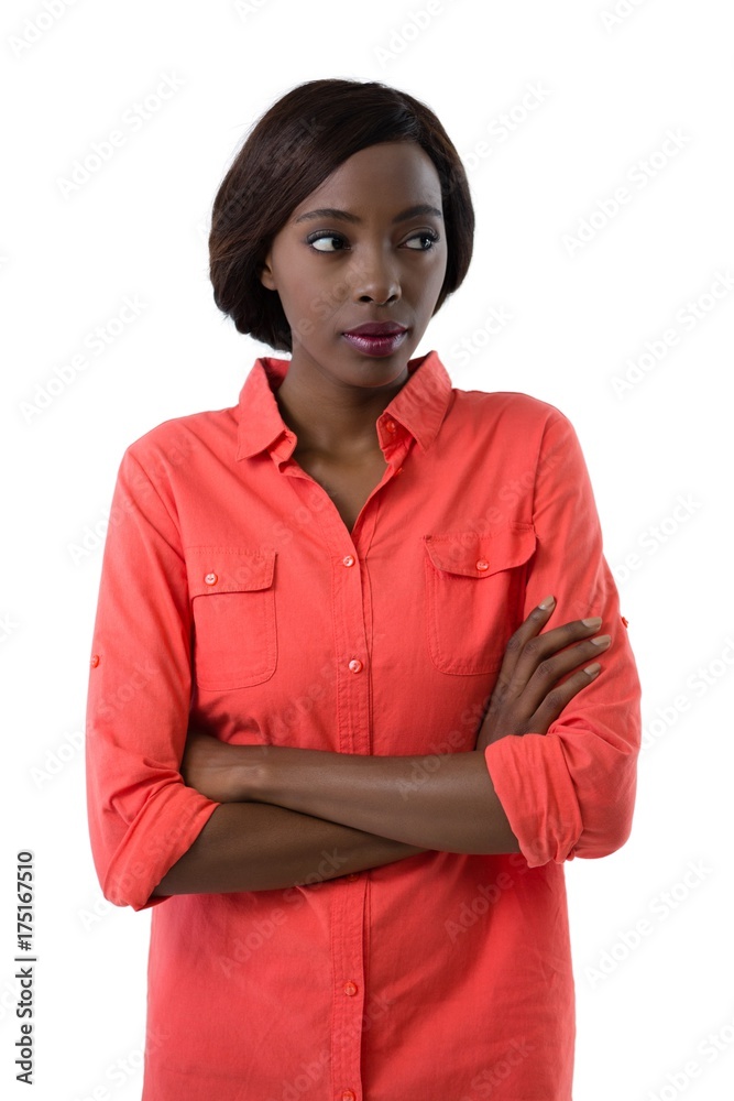 Young woman with arms crossed looking away Young woman with arms crossed looking away