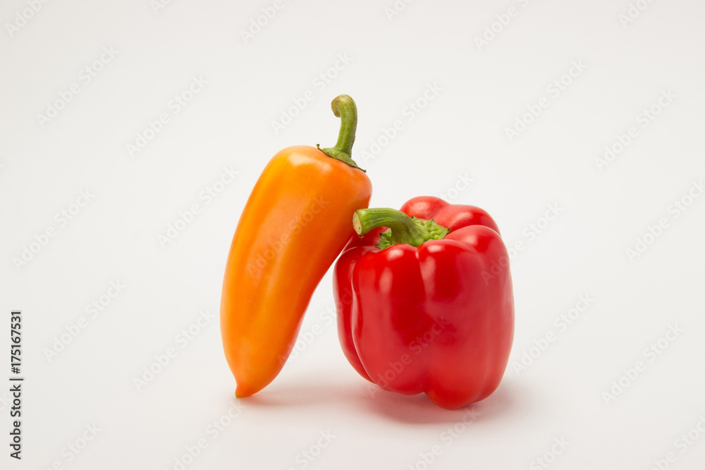 Two beautiful red sweet peppers on a white background Two beautiful red sweet peppers on a white background