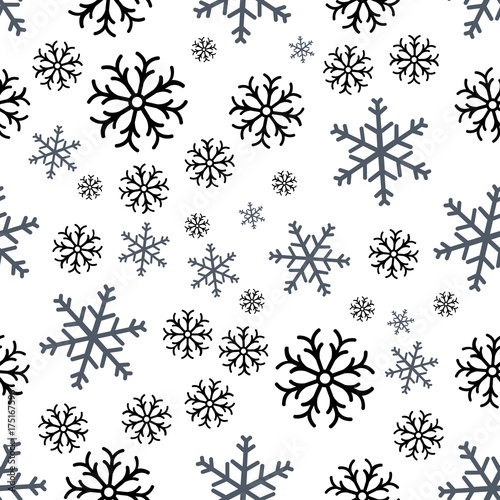 Seamless pattern of snowflakes on a blue background